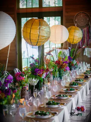 White and gold suspended paper lantern centerpieces. 