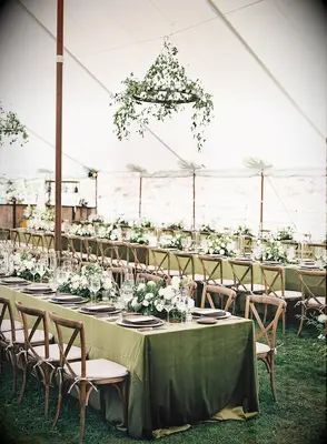 simple hanging wedding flowers with greenery vines on wrought iron chandelier