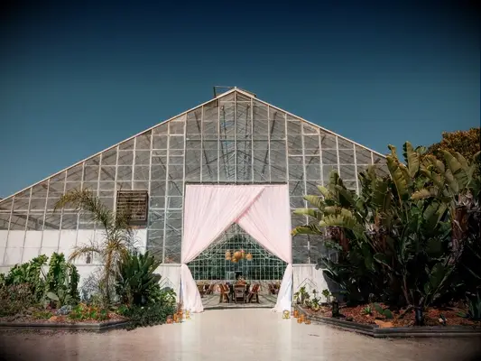 Greenhouse wedding venue with pink draping