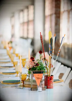 Arrow decoration at camp-themed wedding