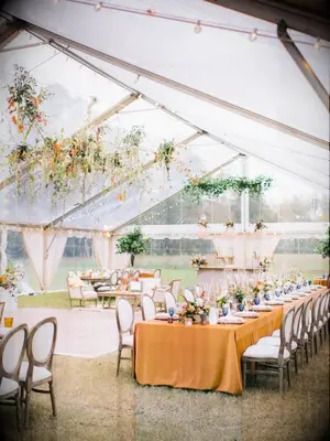 Rustic wedding with orange linens
