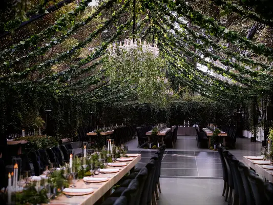 Greenery-filled tent wedding reception