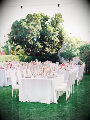 Elegant backyard wedding reception with neutral decorations