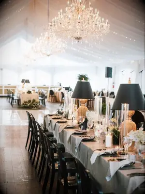 Classic wedding reception table with formal lamp decorations