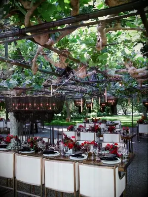Garden wedding reception with dramatic black chandeliers