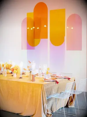 Modern orange tablescape with acrylic accents