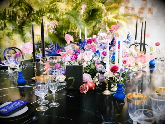 Black-and-indigo tablescape at tropical wedding