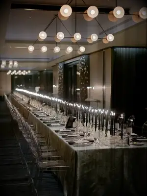 Reception table with black taper candles