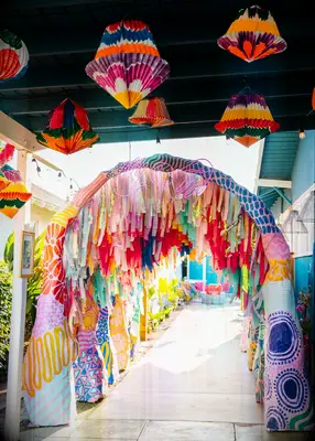 Colorful streamer tunnel at wedding reception