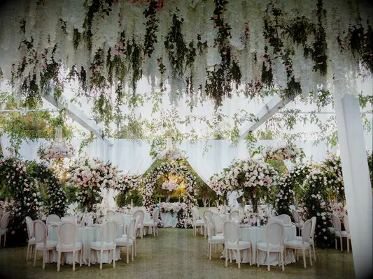 White hanging flowers at wedding reception