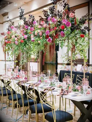 Hotel wedding with fuchsia rose centerpieces