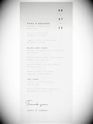 Minimalist black sans-serif type on gray background with elegant date detail in upper right