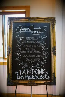 Dinner menu chalkboard at wedding