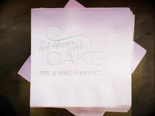 let them eat cake quote on wedding cocktail napkin