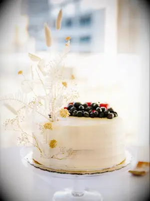 Simple wedding cake with pampas grass and fresh fruit