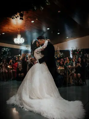 Bride and groom dancing during first dance at wedding reception