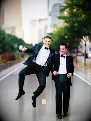 Groom posing for photo with his best man