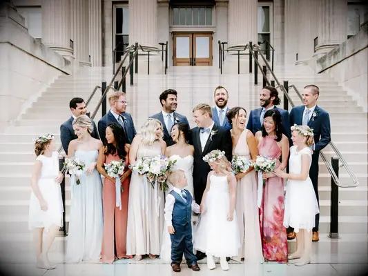 Bride and groom with wedding party and ring bearer and flower girl