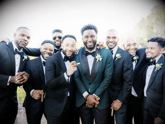 Closeup photo of groom and groomsmen suits on wedding day