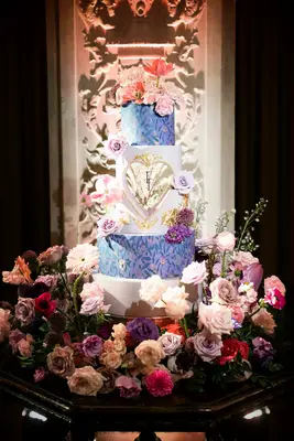 Vibrant, Colorful Four-Tier Wedding Cake Featuring Pink-and-Purple Designs, Heart and FLowers