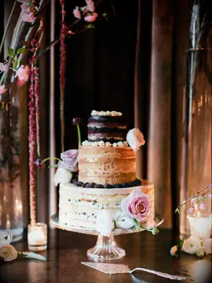 three tier milk bar wedding cake with pink roses