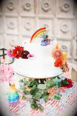 Two-Tier White Wedding Cake With Rainbow Topper