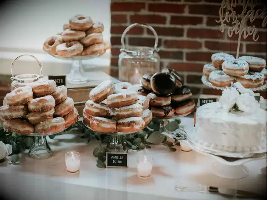 Assorted glazed donut spread at wedding