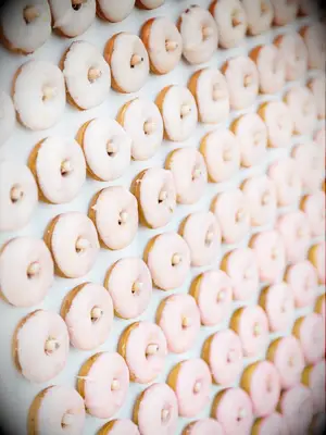 Pink ombré donut wall at wedding
