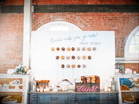 Large donut wall with dessert spread