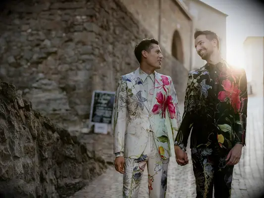 grooms in ornate wedding suits