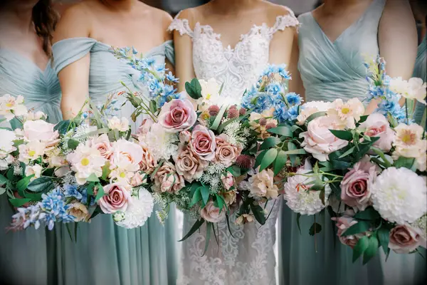 Bride and bridesmaids with rustic bouquets