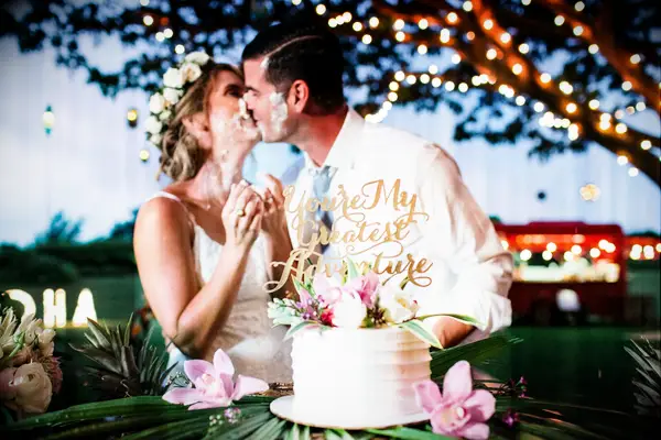 The couple cake-smashed each other for this fun wedding photo