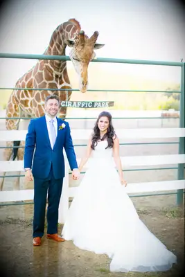 Fun zoo-themed giraffe wedding photo