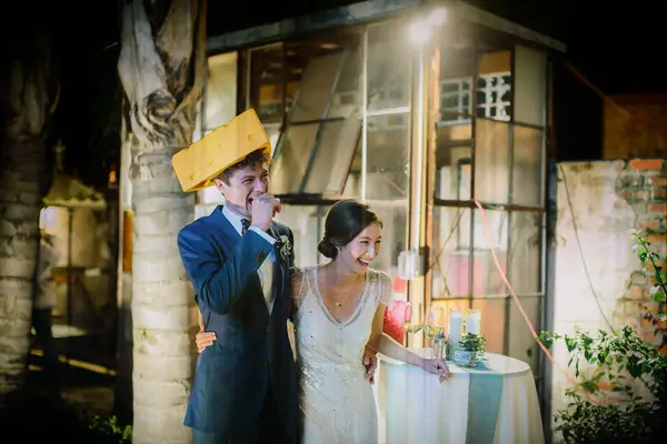 Wisconsin cheesehead-wearing groom and bride