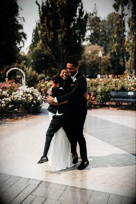 Family group hug wedding photo