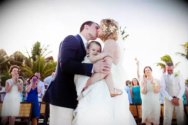 Funny family wedding photo of the couple