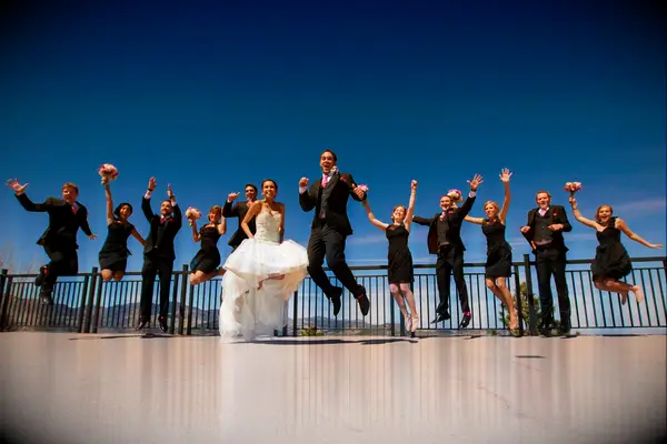 The wedding party caught in a jump photo