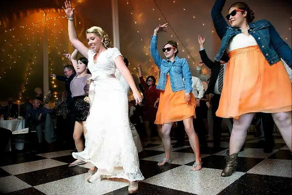 The bride and her wedding party dancing