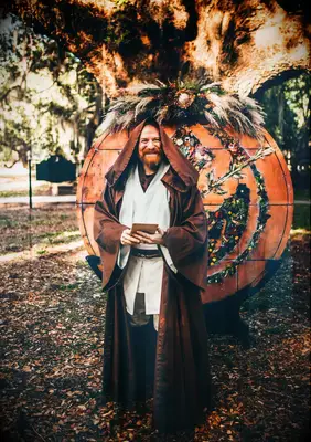 The wedding officiant dressed as Obi-Wan Kenobi