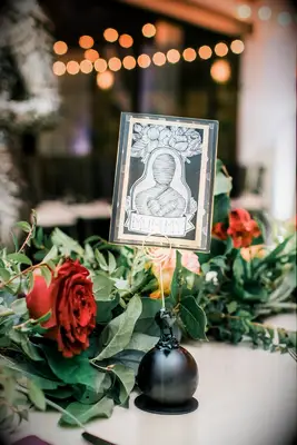 Mummy table name cards at a Halloween wedding