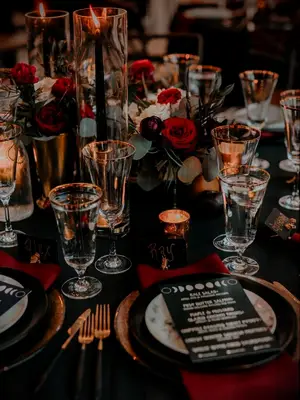 Moody red and black tablescape at a Halloween wedding