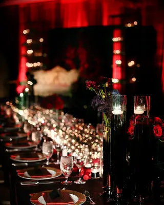Gold, black, and crimson color scheme at a Halloween-themed wedding