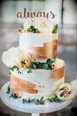 Copper and ivory wedding cake at a Halloween wedding