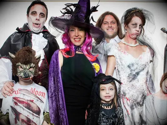 Wedding guests wearing costumes at a Halloween wedding