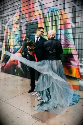Bride wearing Halloween-themed leather jacket