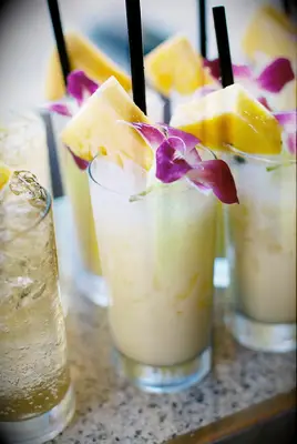 Pina coladas with orchid garnishes