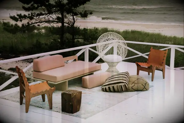 Boho lounge furniture on deck overlooking beach
