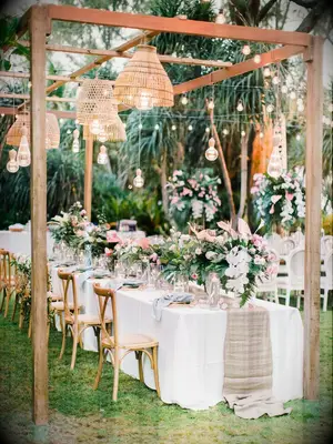 Wedding reception with wood structure for woven chandeliers