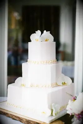 white orchid wedding cake for your beach wedding celebration