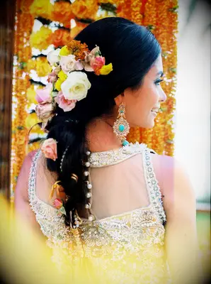 Bride with yellow flowers in braided updo